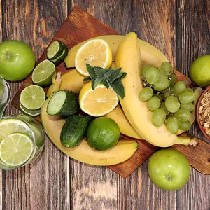 Vegetables, fruits, juice and granola on a dark background. 