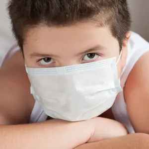 overweight boy wearing covid-19 mask