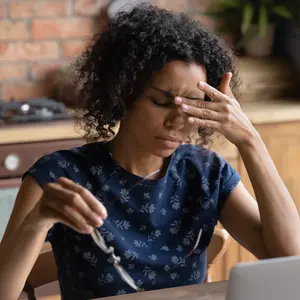 woman work on laptop at home office struggle with migraine or headache