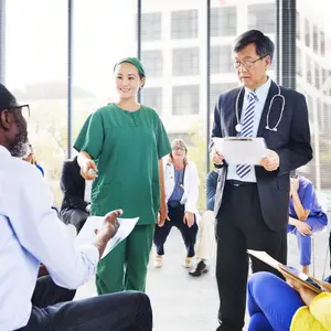 Diverse People Listening to the Doctor's Presentation