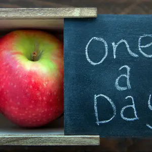 Apple in a natural wooden box. One a day keeps the Doctor away