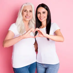 aged mother young daughter hugging showing fingers heart figure symbolizing cardiac health 