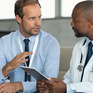 patient giving medical history to doctor