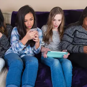 Group of kids on their mobile device