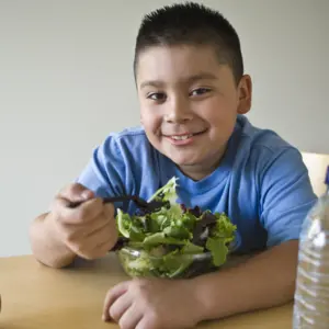 Portrait of a happy obese boy on a diet