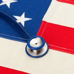 USA flag with stethoscope over it USA flag with stethoscope over it
