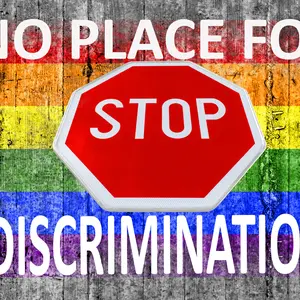 No place for discrimination and STOP sign and LGBT flag painted on background texture gray concrete No place for discrimination and STOP sign and LGBT flag painted on background texture gray concrete