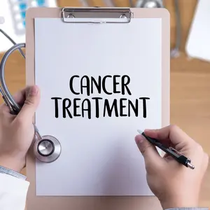 CANCER TREATMENT on clipboard