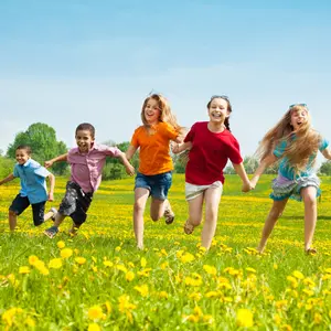 Group of seven running in the park