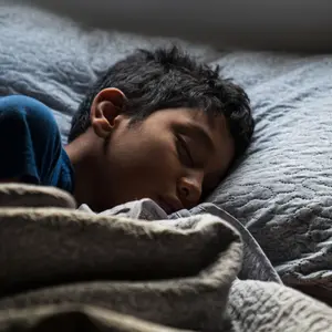 A Hispanic Young Boy Sleeping 
