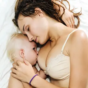 Woman is breastfeeding her child.