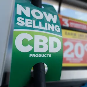 Closeup of CBD product sign at a gas station