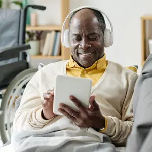 Man listening to music on tablet 