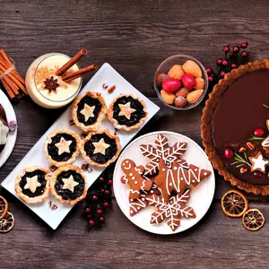 Assorted holiday desserts and sweets. - Bundt cake, chocolate pie, mincemeat tarts, cookies, fudge and eggnog.