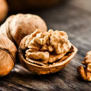 Walnuts on dark vintage table