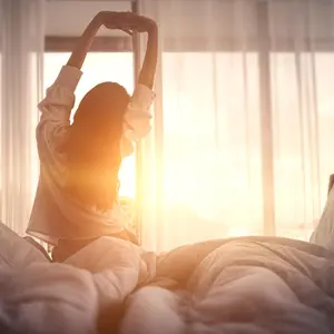 Woman streching in morning light