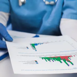 Doctor wearing protective gloves holding document chart analyzing graph data