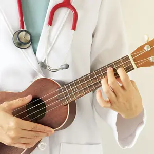 Doctor playing ukulele, Music therapy concept