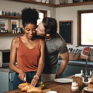 Couple kissing in the kitchen