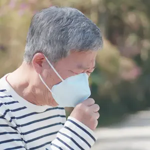 Asian old man coughs and wear protective mask