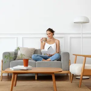 Woman reading a book in a minimalist living space