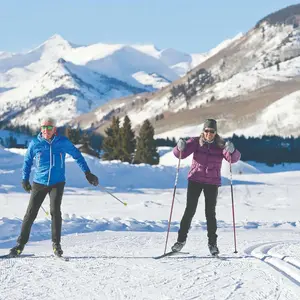 Older couple cross-country skiing
