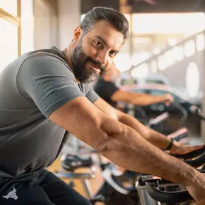 Man riding a stationary bicycle