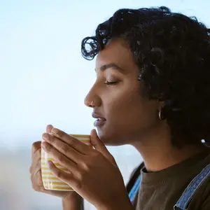 Woman enjoying cup of tea