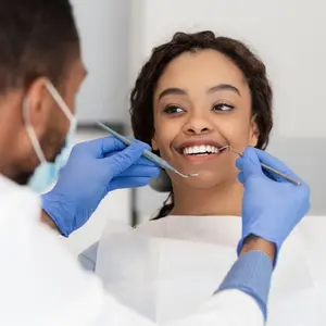Woman receiving dental exam