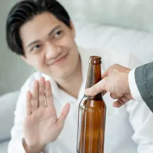 man saying no to beer