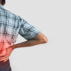 Asian elder man suffering from right sided low back pain. 
