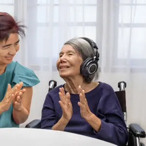 Music therapy in dementia treatment on elderly woman Music therapy in dementia treatment on elderly woman