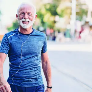 A man walking wearing blue shirt