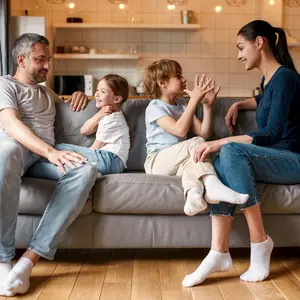 Mom and Dad with kids on couch