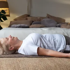Senior caucasian woman practicing nidra yoga 