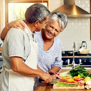 A couple cooking in the kitchen