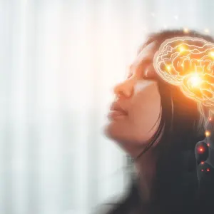 Concept are of a woman with nervous system in brain lighting up, illustrative of emerging polyvagal theory
