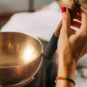 singing bowls being played over patient