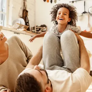 happy family playing together in house