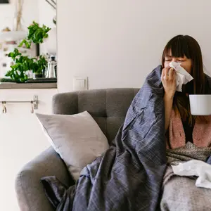 woman home sick with the common cold