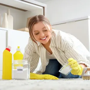 Young woman cleaning with baking soda
