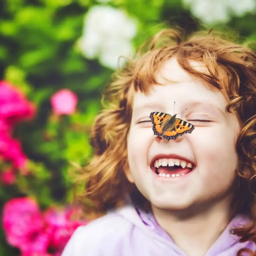 Girl with butterfly on nose